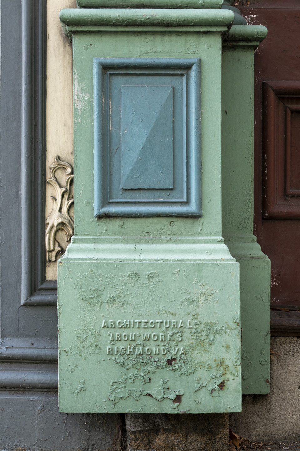 An iron storefront column manufactured by Architctural Iron Works of Richmond, Virginia, seen in Richmond.