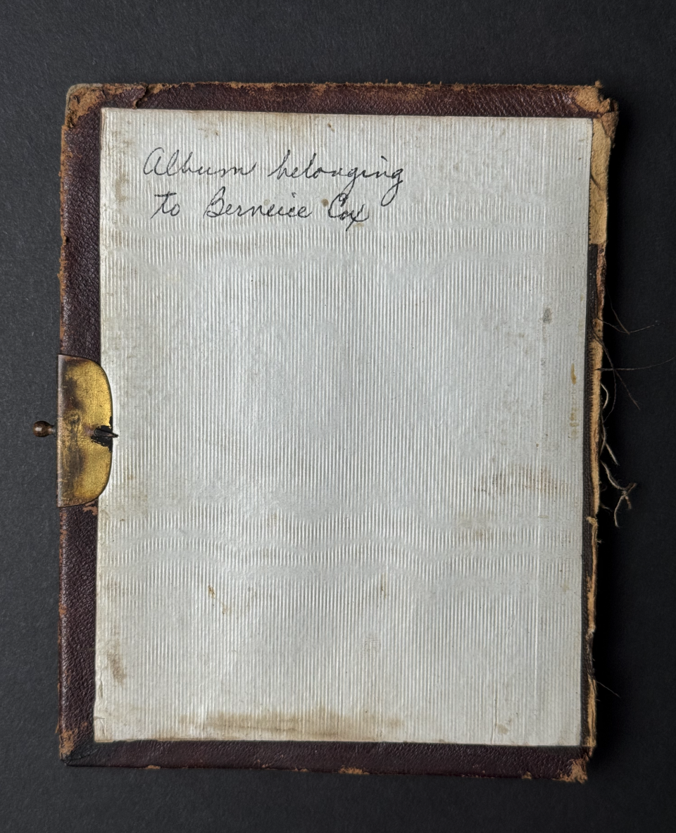 The inside cover of the album is inscribed with black ballpoint pen, "Album belonging to Berneice Cox." Since the rest of the album is marked in pencil with a diffrerent hand, and since ballpoint pen wasn't common until about the 1940s, I think this was written by a descendant.
