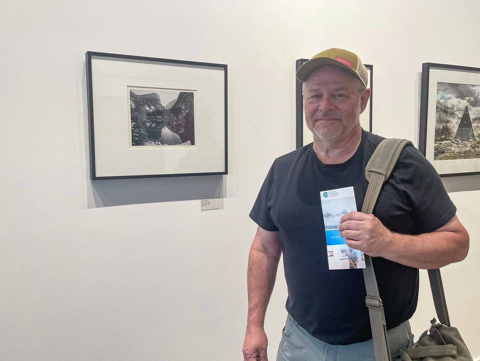 Seen here with an original signed Ansel Adams landscape photograph at CPAC in Denver.