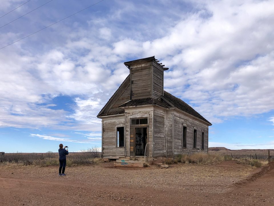 Teena at the ruins of an old church along the Llano Estacado in New Mexico, not far from the grave of Billy the Kid.