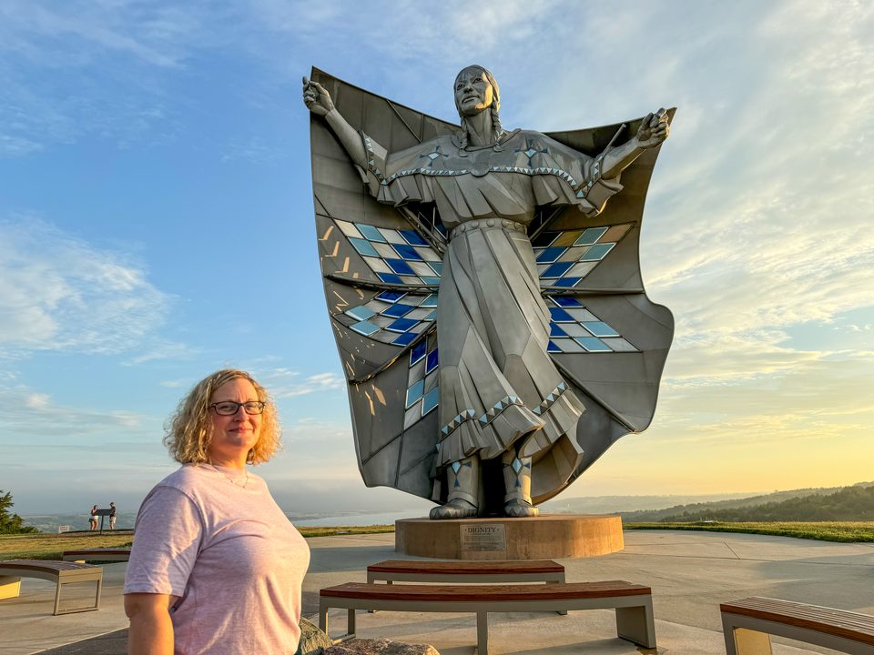Teena with Dignity of Earth and Sky on a bluff overlooking the Missouri River in South Dakota. It's a 50-foot (15 m) tall statue by South Dakota artist laureate Dale Claude Lamphere.