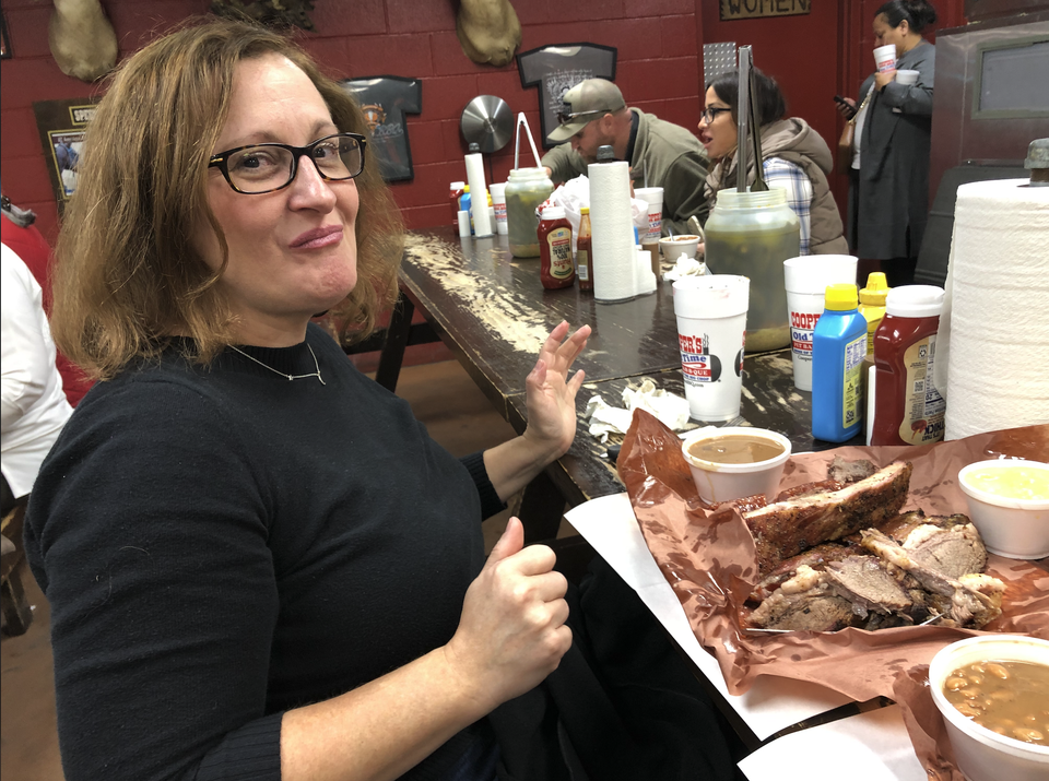 Teena feeling overwhelmed by the meat feast before her at Cooper's BBQ in Llano, Texas.