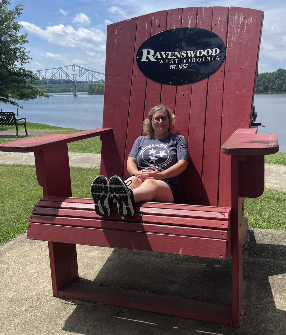 A big red chair in West Virginia. The Ohio River can be seen in the background.